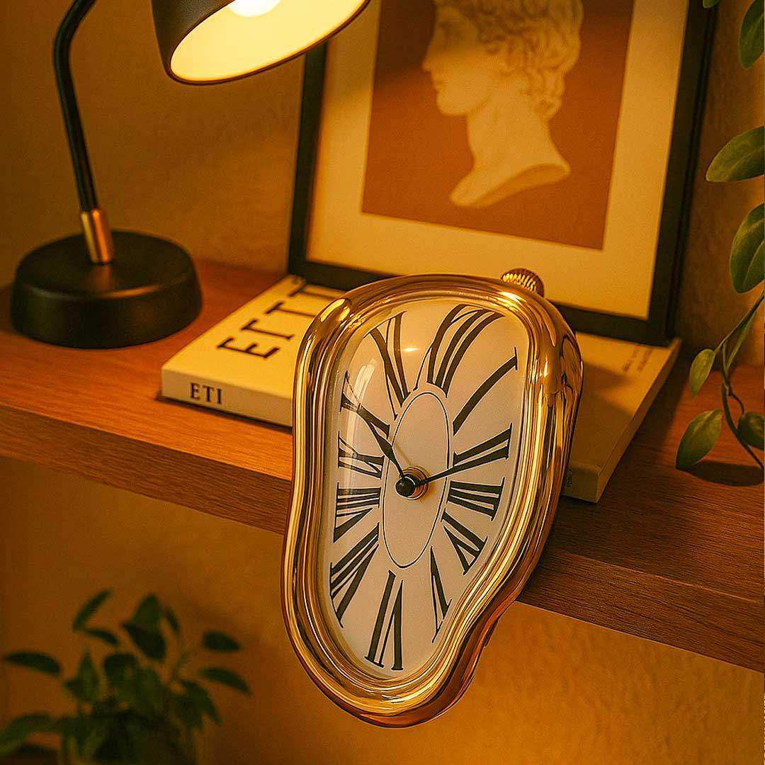Gold Melting Clock draped over the edge of a shelf