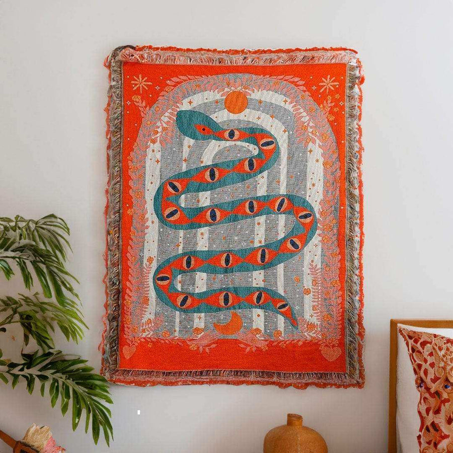 Serpent woven tapestry throw with bold snake artwork and tasselled edge